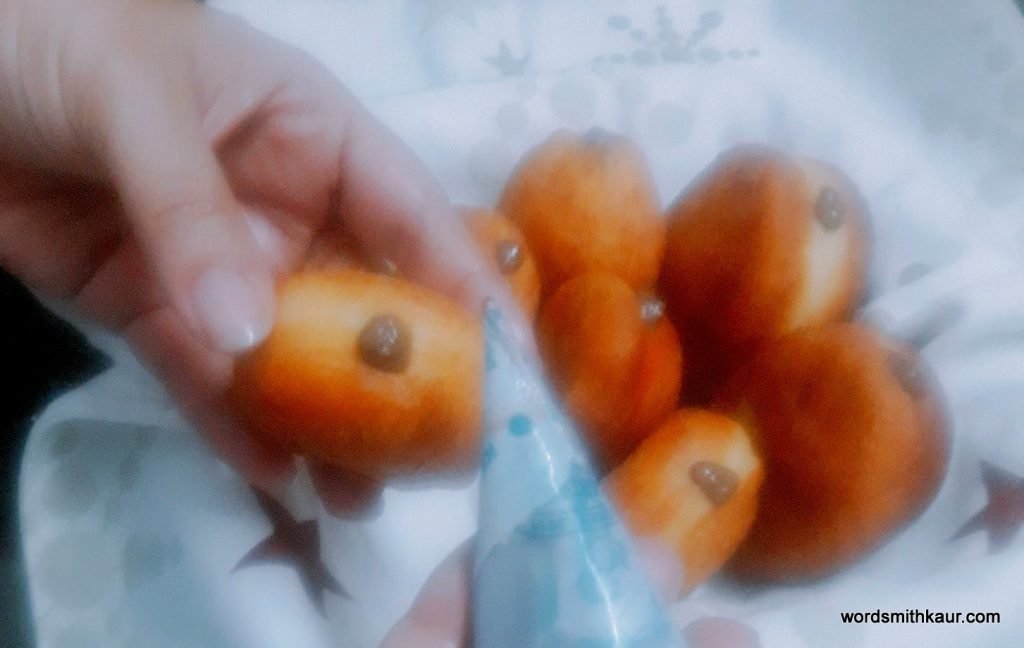Homemade Mini-doughnuts stuffed with Strawberry Compote and Chocolate custard.