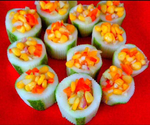 delectable corn salad in cucumber boats