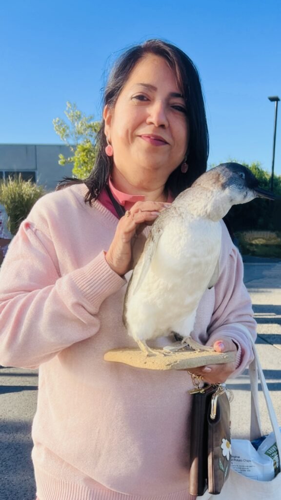 holding a Stuffed Penguin
